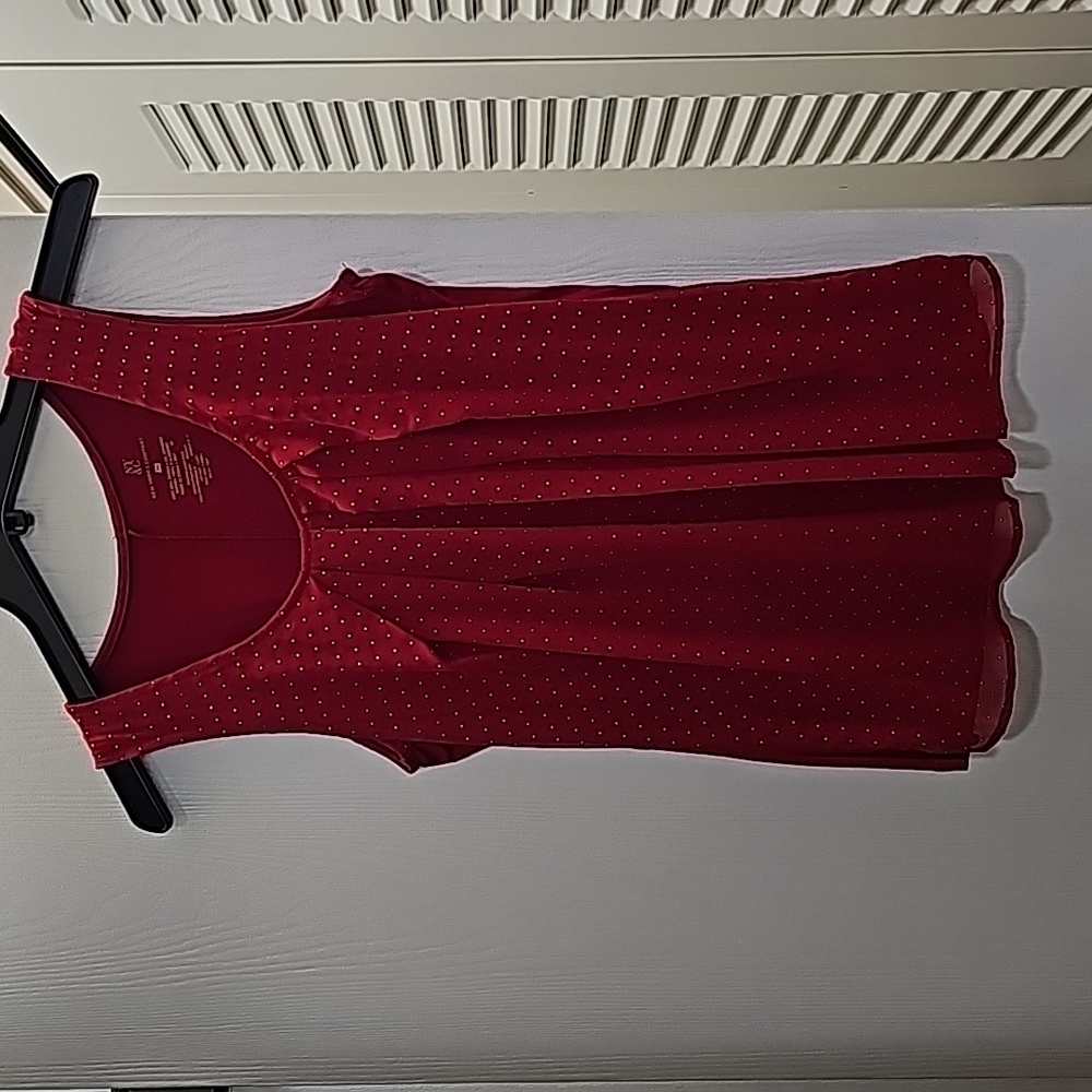Red tank with gold sparkles in a size xs.